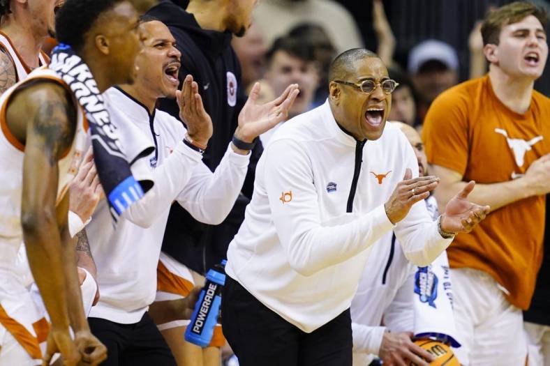Mar 24, 2023; Kansas City, MO, USA; Texas Longhorns head coach Rodney Terry cheers from the bench during the first half of an NCAA tournament Midwest Regional semifinal against the Xavier Musketeers at T-Mobile Center. Mandatory Credit: Jay Biggerstaff-USA TODAY Sports