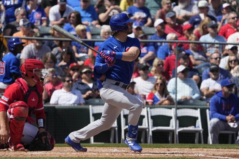 Chicago Cubs' Zach McKinstry runs the bases after hitting a two