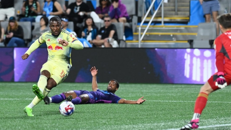 Mar 25, 2023; Charlotte, North Carolina, USA; New York Red Bulls attacker Elias Manoel (11) shoots goal in the first half against Charlotte FC at Bank of America Stadium. Mandatory Credit: Griffin Zetterberg-USA TODAY Sports