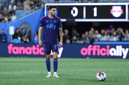 Mar 25, 2023; Charlotte, North Carolina, USA; Charlotte FC midfielder Nuno Santos (77) gets ready for free kick in the second half against New York Red Bulls at Bank of America Stadium. Mandatory Credit: Griffin Zetterberg-USA TODAY Sports