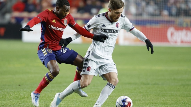 Mar 25, 2023; Sandy, Utah, USA;  Real Salt Lake midfielder Anderson Julio (29) and St. Louis City midfielder Indiana Vassilev (19) battle in the first half at America First Field. Mandatory Credit: Jeffrey Swinger-USA TODAY Sports