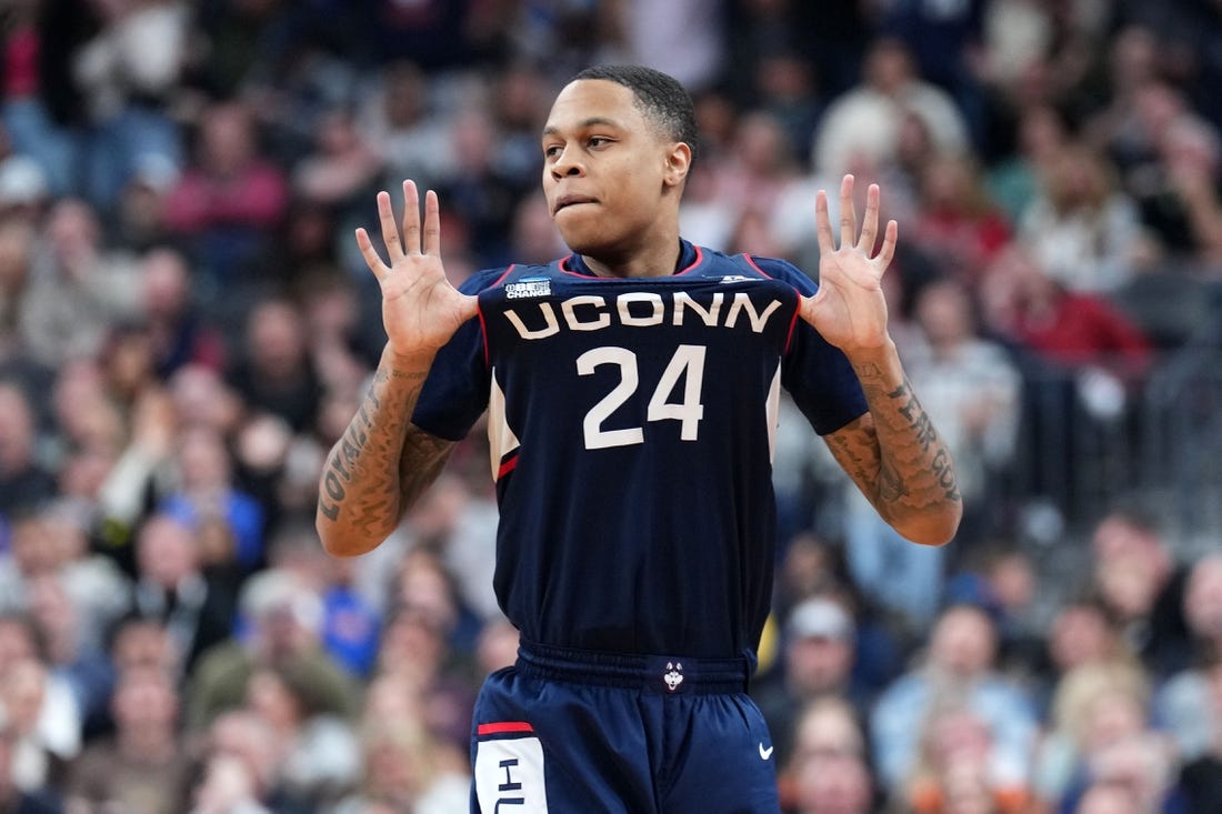 Mar 25, 2023; Las Vegas, NV, USA; Connecticut Huskies guard Jordan Hawkins (24) reacts against the Gonzaga Bulldogs during the second half for the NCAA tournament West Regional final at T-Mobile Arena. Mandatory Credit: Joe Camporeale-USA TODAY Sports