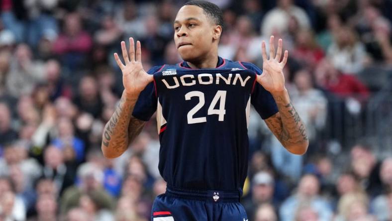 Mar 25, 2023; Las Vegas, NV, USA; Connecticut Huskies guard Jordan Hawkins (24) reacts against the Gonzaga Bulldogs during the second half for the NCAA tournament West Regional final at T-Mobile Arena. Mandatory Credit: Joe Camporeale-USA TODAY Sports