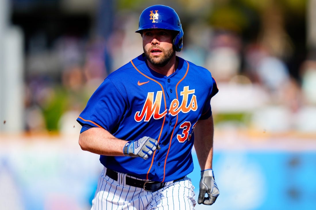 Mar 26, 2023; Port St. Lucie, Florida, USA; New York Mets first baseman Darin Ruf (33) runs into third base against the Miami Marlins during the second inning at Clover Park. Mandatory Credit: Rich Storry-USA TODAY Sports