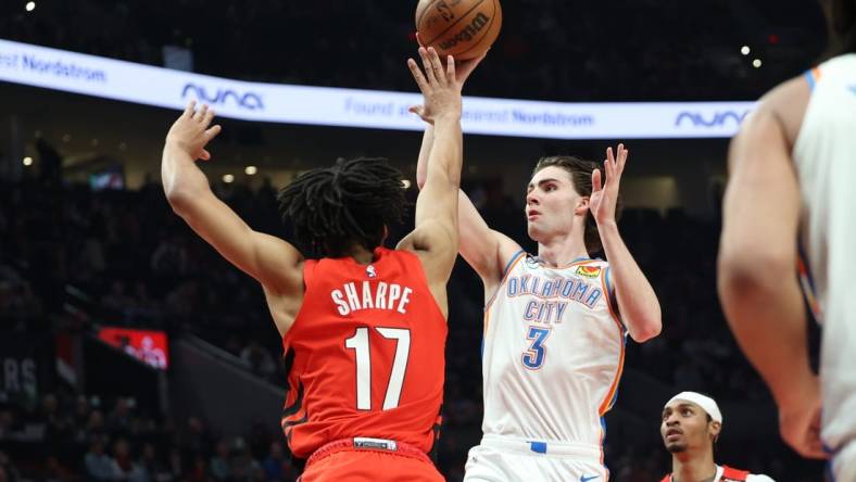 Mar 26, 2023; Portland, Oregon, USA;  Oklahoma City Thunder guard Josh Giddey (3) shoots the ball over Portland Trail Blazers guard Shaedon Sharpe (17) in the first half at Moda Center. Mandatory Credit: Jaime Valdez-USA TODAY Sports