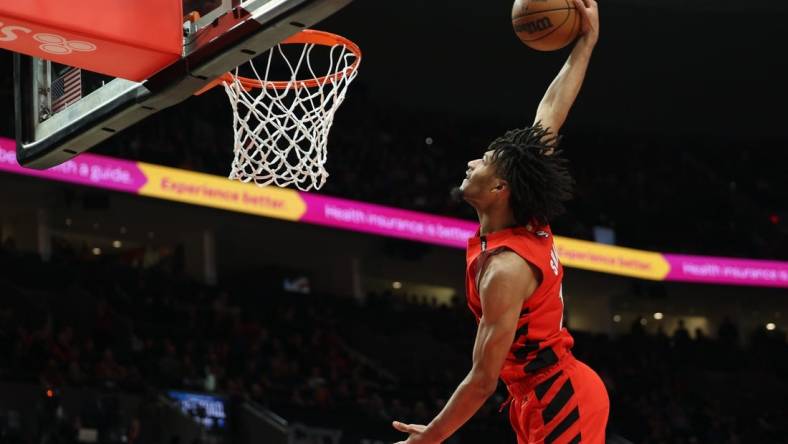 Mar 26, 2023; Portland, Oregon, USA;  Portland Trail Blazers guard Shaedon Sharpe (17) dunks the ball in the second half against the Oklahoma City Thunder at Moda Center. Mandatory Credit: Jaime Valdez-USA TODAY Sports