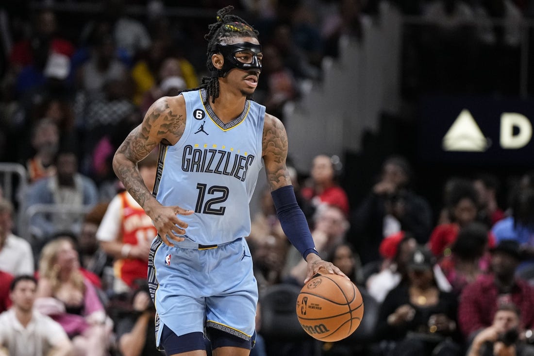 Mar 26, 2023; Atlanta, Georgia, USA; Memphis Grizzlies guard Ja Morant (12) dribbles against the Atlanta Hawks during the second half at State Farm Arena. Mandatory Credit: Dale Zanine-USA TODAY Sports