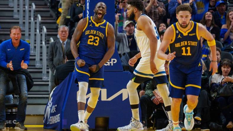 Mar 26, 2023; San Francisco, California, USA;  Golden State Warriors forward Draymond Green (23) celebrates after the basket during the second quarter against the Minnesota Timberwolves at Chase Center. Mandatory Credit: Neville E. Guard-USA TODAY Sports