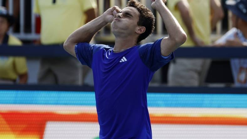 Mar 27, 2023; Miami, Florida, US; Francisco Cerundolo (ARG) celebrates after his match against Felix Auger-Aliassime (CAN) on day eight of the Miami Open at Hard Rock Stadium. Mandatory Credit: Geoff Burke-USA TODAY Sports