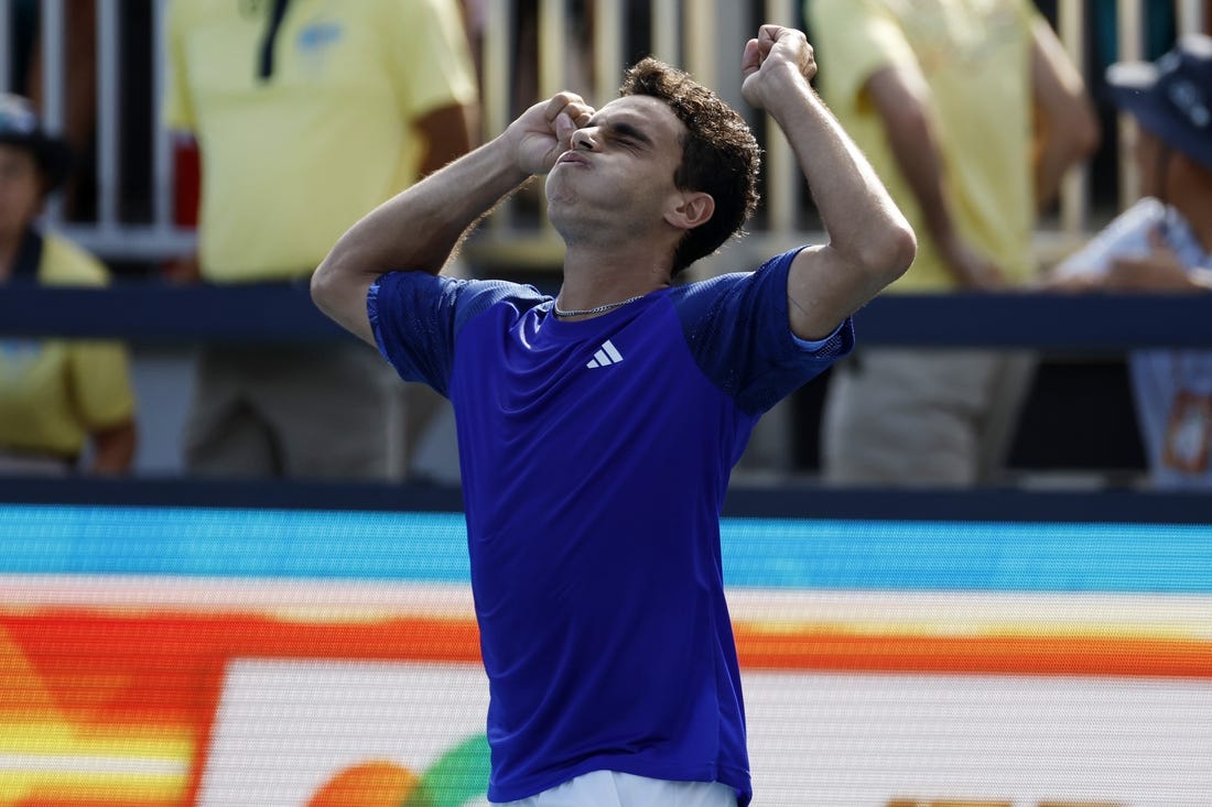 Mar 27, 2023; Miami, Florida, US; Francisco Cerundolo (ARG) celebrates after his match against Felix Auger-Aliassime (CAN) on day eight of the Miami Open at Hard Rock Stadium. Mandatory Credit: Geoff Burke-USA TODAY Sports