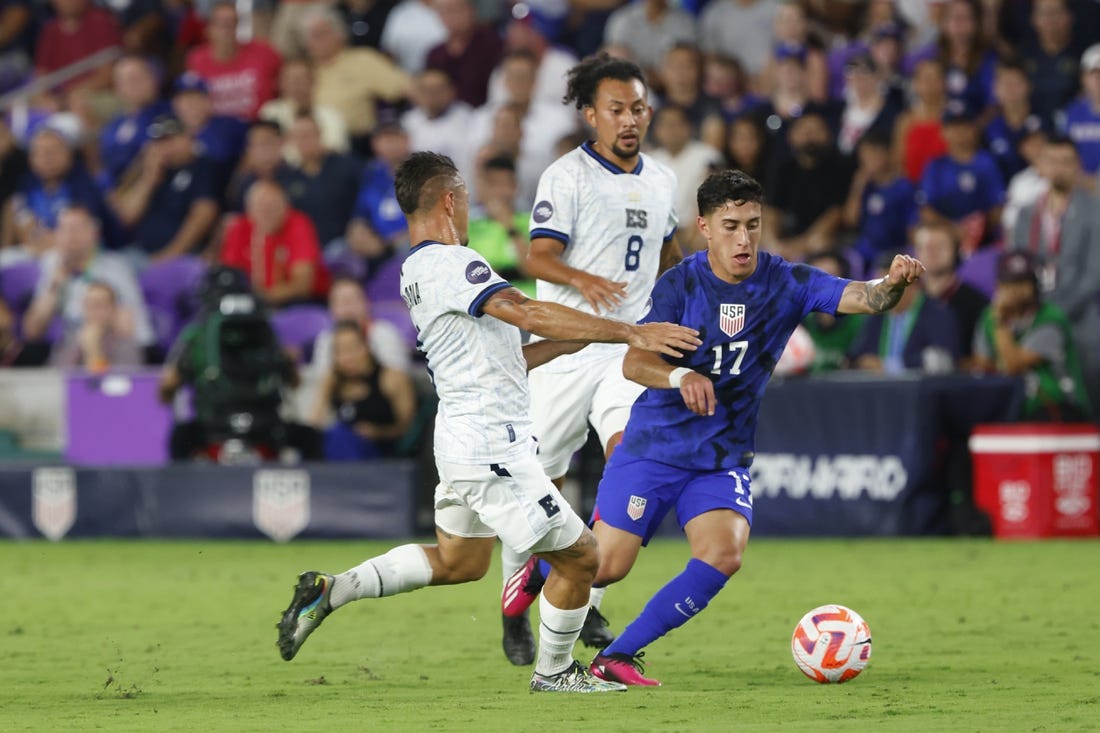 Mar 27, 2023; Orlando, Florida, USA; El Salvador midfielder Narciso Orellana (6) and El Salvador midfielder Bryan Landaverde (8) battle United States of America forward Alex Zendejas (17) for the ball during the first half at Exploria Stadium. Mandatory Credit: Reinhold Matay-USA TODAY Sports