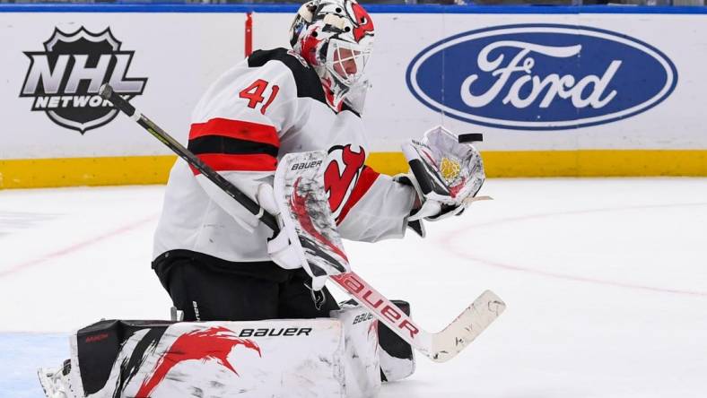 Mar 27, 2023; Elmont, New York, USA;  New Jersey Devils goaltender Vitek Vanecek (41) makes a glove save against the New York Islanders during the second period at UBS Arena. Mandatory Credit: Dennis Schneidler-USA TODAY Sports