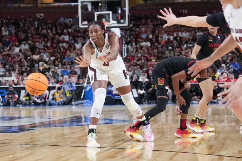 Mar 27, 2023; Greenville, SC, USA;  South Carolina Gamecocks forward Aliyah Boston (4) passes off against the Maryland Terrapins during the second half at the NCAA Women   s Tournament at Bon Secours Wellness Arena. Mandatory Credit: Jim Dedmon-USA TODAY Sports