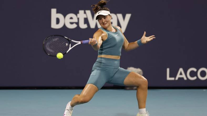 Mar 27, 2023; Miami, Florida, US; Bianca Andreescu (CAN) hits a forehand against Ekaterina Alexandrova (not pictured) on day eight of the Miami Open at Hard Rock Stadium. Mandatory Credit: Geoff Burke-USA TODAY Sports