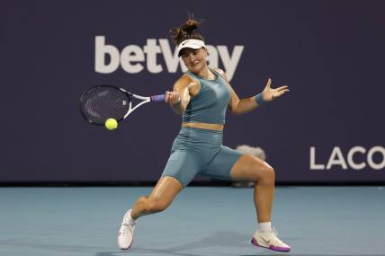Mar 27, 2023; Miami, Florida, US; Bianca Andreescu (CAN) hits a forehand against Ekaterina Alexandrova (not pictured) on day eight of the Miami Open at Hard Rock Stadium. Mandatory Credit: Geoff Burke-USA TODAY Sports