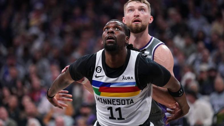 Mar 27, 2023; Sacramento, California, USA; Minnesota Timberwolves center Naz Reid (11) boxes out Sacramento Kings forward Domantas Sabonis (10) in the third quarter at the Golden 1 Center. Mandatory Credit: Cary Edmondson-USA TODAY Sports