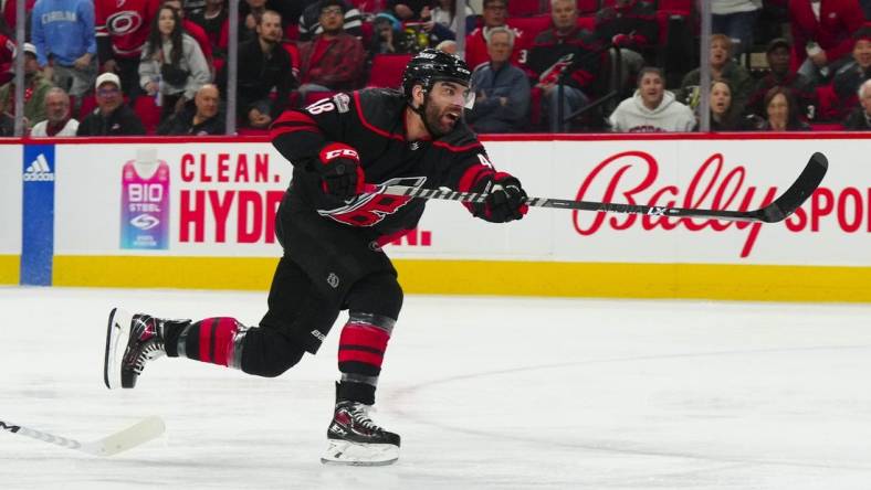 Mar 28, 2023; Raleigh, North Carolina, USA;  Carolina Hurricanes left wing Jordan Martinook (48) takes a shot against the Tampa Bay Lightning during the first period at PNC Arena. Mandatory Credit: James Guillory-USA TODAY Sports