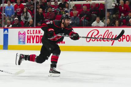 Mar 28, 2023; Raleigh, North Carolina, USA;  Carolina Hurricanes left wing Jordan Martinook (48) takes a shot against the Tampa Bay Lightning during the first period at PNC Arena. Mandatory Credit: James Guillory-USA TODAY Sports