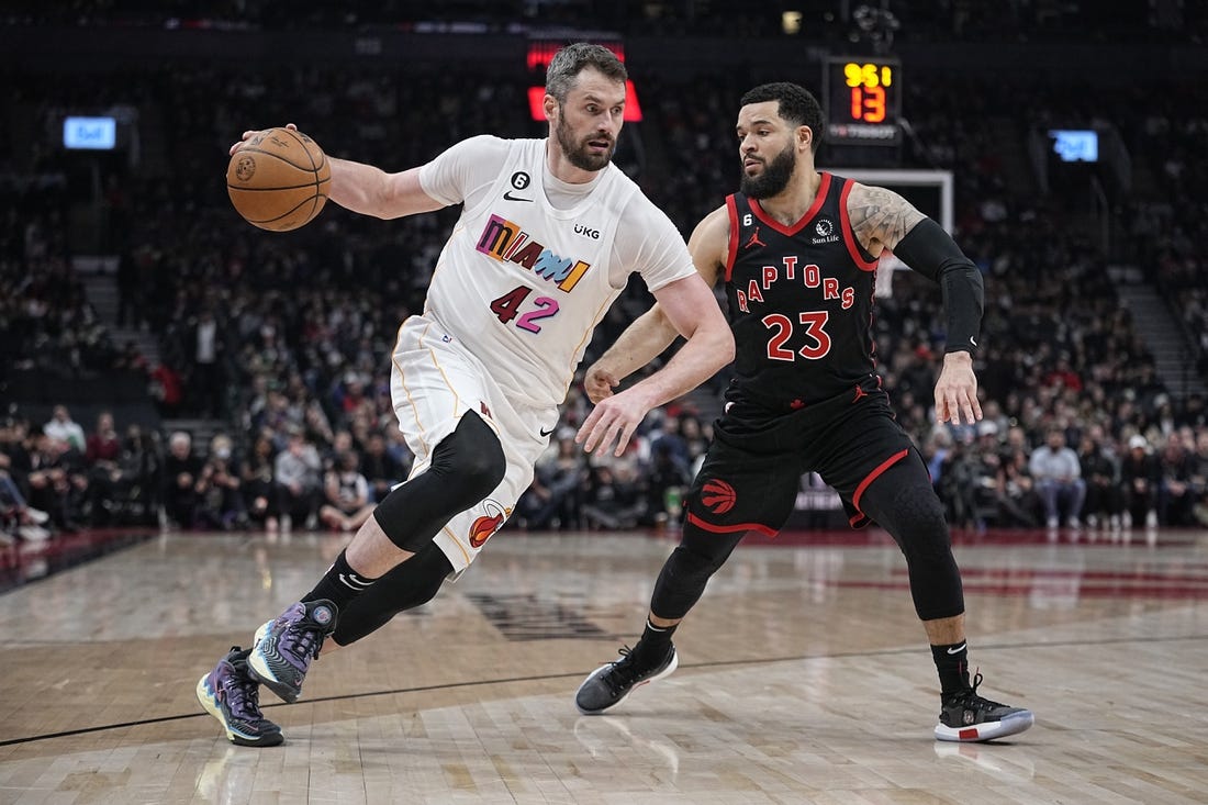 Mar 28, 2023; Toronto, Ontario, CAN; Miami Heat forward Kevin Love (42) drives to the net against Toronto Raptors guard Fred VanVleet (23) during the first half at Scotiabank Arena. Mandatory Credit: John E. Sokolowski-USA TODAY Sports