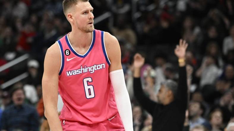 Mar 28, 2023; Washington, District of Columbia, USA; Washington Wizards center Kristaps Porzingis (6) reacts after a basket against the Boston Celtics during the second half at Capital One Arena. Mandatory Credit: Brad Mills-USA TODAY Sports