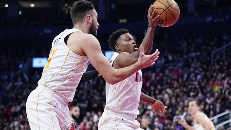 Mar 28, 2023; Toronto, Ontario, CAN; Miami Heat guard Kyle Lowry (7) and guard Max Strus (31) battle for a rebound against the Toronto Raptors during the second half at Scotiabank Arena. Mandatory Credit: John E. Sokolowski-USA TODAY Sports