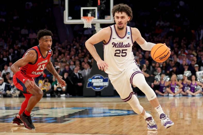 Mar 25, 2023; New York, NY, USA; Kansas State Wildcats forward Ismael Massoud (25) drives to the basket against Florida Atlantic Owls guard Brandon Weatherspoon (23) during the first half at Madison Square Garden. Mandatory Credit: Brad Penner-USA TODAY Sports