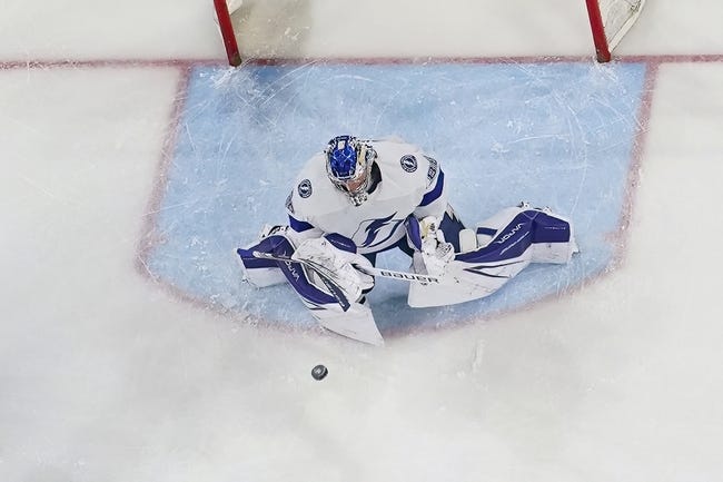 Mar 28, 2023; Raleigh, North Carolina, USA;  Tampa Bay Lightning goaltender Andrei Vasilevskiy (88) makes a save against the Carolina Hurricanes during the second period at PNC Arena. Mandatory Credit: James Guillory-USA TODAY Sports