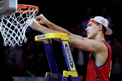 Mar 25, 2023; New York, NY, USA; Florida Atlantic Owls center Vladislav Goldin (50) cuts a piece of the net after defeating the Kansas State Wildcats at Madison Square Garden to advance to the final four. Mandatory Credit: Brad Penner-USA TODAY Sports
