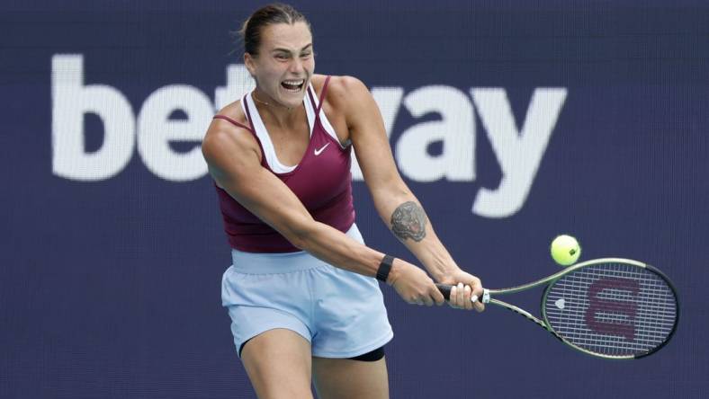 Mar 29, 2023; Miami, Florida, US; Aryna Sabalenka hits a backhand against Sorana Cirstea (ROU) (not pictured) in a women's singles quarterfinal on day ten of the Miami Open at Hard Rock Stadium. Mandatory Credit: Geoff Burke-USA TODAY Sports