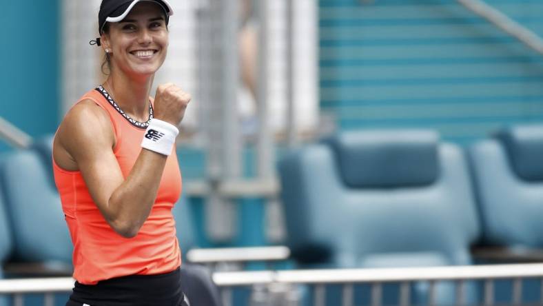 Mar 29, 2023; Miami, Florida, US; Sorana Cirstea (ROU)  celebrates after her match against Aryna Sabalenka (L) in a women's singles quarterfinal on day ten of the Miami Open at Hard Rock Stadium. Mandatory Credit: Geoff Burke-USA TODAY Sports