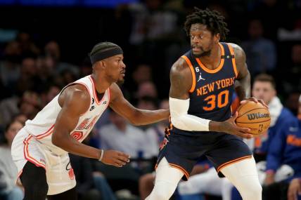 Mar 29, 2023; New York, New York, USA; New York Knicks forward Julius Randle (30) controls the ball against Miami Heat forward Jimmy Butler (22) during the first quarter at Madison Square Garden. Mandatory Credit: Brad Penner-USA TODAY Sports