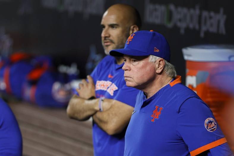 Mar 30, 2023; Miami, Florida, USA; New York Mets manager Buck Showalter (11) looks on from inside the dugout prior to the game against the Miami Marlins at loanDepot Park. Mandatory Credit: Sam Navarro-USA TODAY Sports