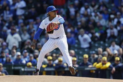 Mar 30, 2023; Chicago, Illinois, USA; Chicago Cubs starting pitcher Marcus Stroman (0) delivers against the Milwaukee Brewers during the first inning at Wrigley Field. Mandatory Credit: Kamil Krzaczynski-USA TODAY Sports