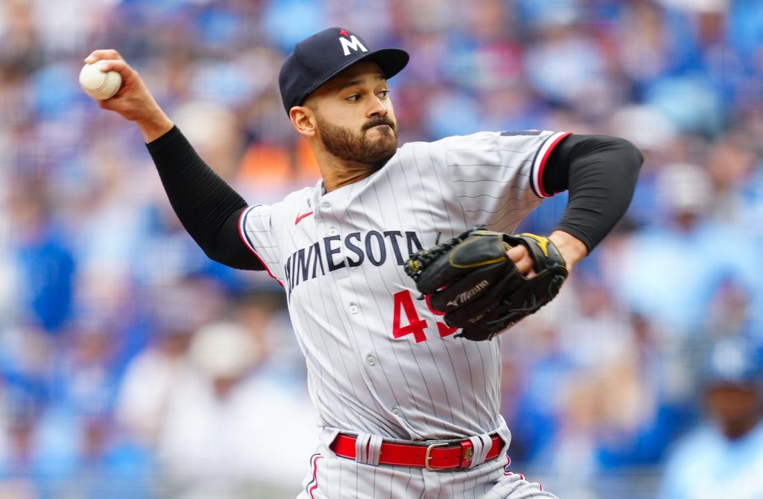 Mar 30, 2023; Kansas City, Missouri, USA; Minnesota Twins starting pitcher Pablo Lopez (49) pitches during the first inning against the Kansas City Royals at Kauffman Stadium. Mandatory Credit: Jay Biggerstaff-USA TODAY Sports