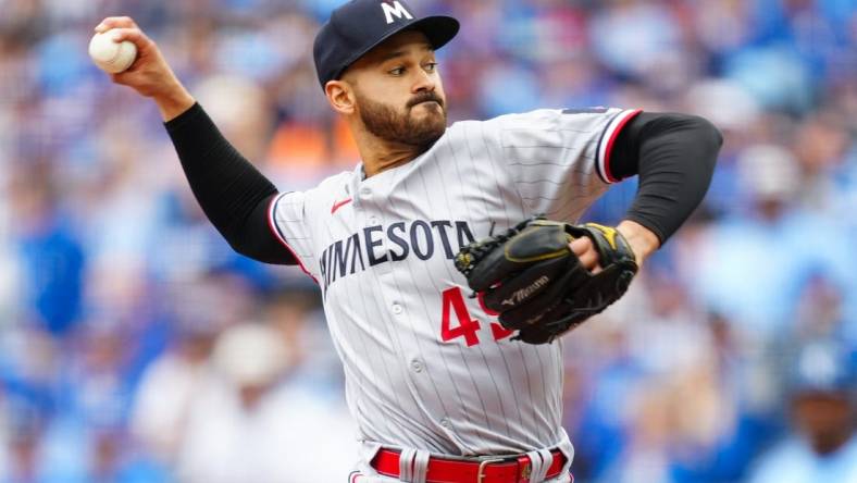 Mar 30, 2023; Kansas City, Missouri, USA; Minnesota Twins starting pitcher Pablo Lopez (49) pitches during the first inning against the Kansas City Royals at Kauffman Stadium. Mandatory Credit: Jay Biggerstaff-USA TODAY Sports