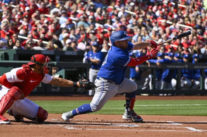Mar 30, 2023; St. Louis, Missouri, USA;  Toronto Blue Jays catcher Alejandro Kirk (30) hits a two run single against the St. Louis Cardinals during the first inning at Busch Stadium. Mandatory Credit: Jeff Curry-USA TODAY Sports
