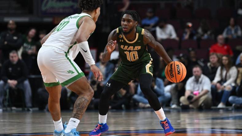 Mar 30, 2023; Las Vegas, NV, USA; North Texas Mean Green guard Kai Huntsberry (10) defends UAB Blazers guard Jordan Walker (10) in the first half at Orleans Arena. Mandatory Credit: Candice Ward-USA TODAY Sports