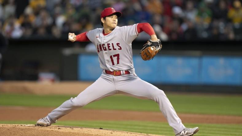 March 30, 2023; Oakland, California, USA; Los Angeles Angels starting pitcher Shohei Ohtani (17) delivers a pitch against the Oakland Athletics during the first inning at RingCentral Coliseum. Mandatory Credit: Kyle Terada-USA TODAY Sports