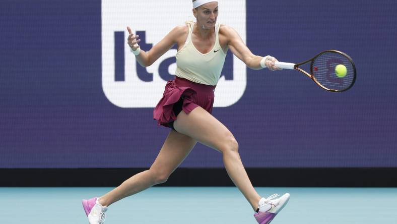 Mar 31, 2023; Miami, Florida, US; Petra Kvitova (CZE) hits a forehand against Sorana Cirstea (ROU) (not pictured) in a women's singles semifinal on day twelve on the Miami Open at Hard Rock Stadium. Mandatory Credit: Geoff Burke-USA TODAY Sports