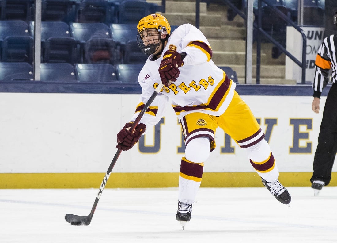 Mar 14, 2021; South Bend, Indiana, USA; Minnesota's Brock Faber (14) shoots against Michigan State at the Compton Family Ice Arena. Mandatory Credit: Michael Caterina/South Bend Tribune-USA TODAY NETWORK