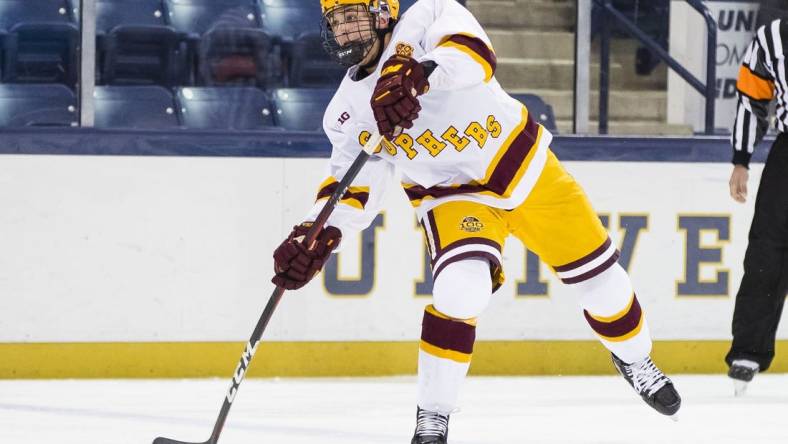 Mar 14, 2021; South Bend, Indiana, USA; Minnesota's Brock Faber (14) shoots against Michigan State at the Compton Family Ice Arena. Mandatory Credit: Michael Caterina/South Bend Tribune-USA TODAY NETWORK