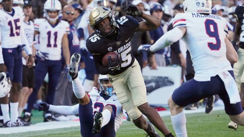 Oct 16, 2021; Boulder, Colorado, USA; Colorado Buffaloes wide receiver Montana Lemonious-Craig (15) carries the ball against the Arizona Wildcats in the fourth quarter at Folsom Field. Mandatory Credit: Ron Chenoy-USA TODAY Sports