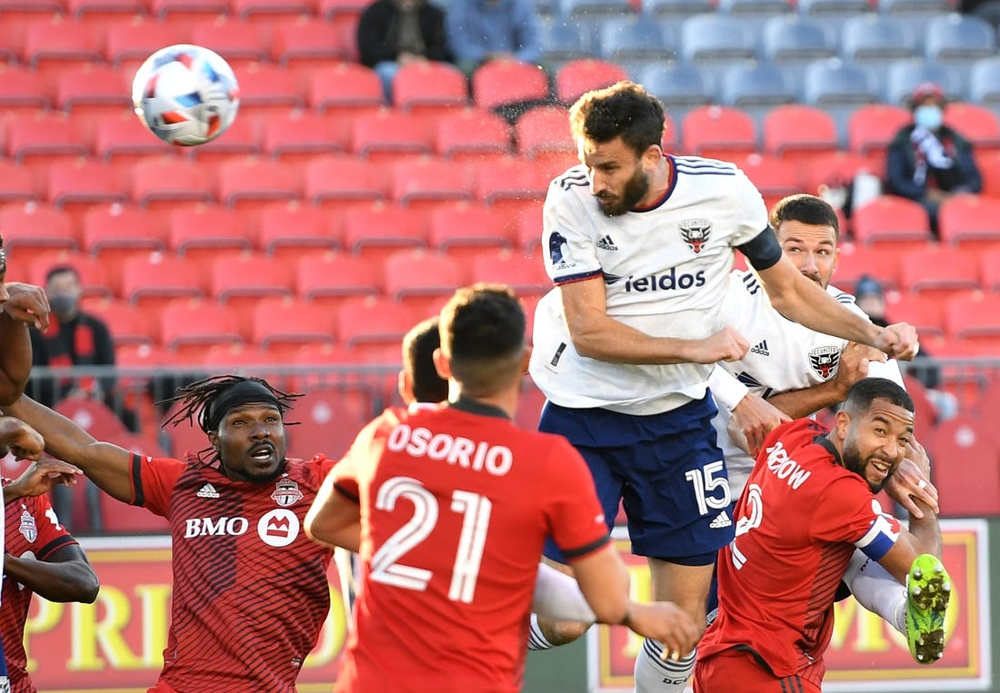 Nov 7, 2021; Toronto, Ontario, CAN;   DC United defender Steven Birnbaum (15) scores on a header against Toronto FC in the first half at BMO Field. Mandatory Credit: Dan Hamilton-USA TODAY Sports