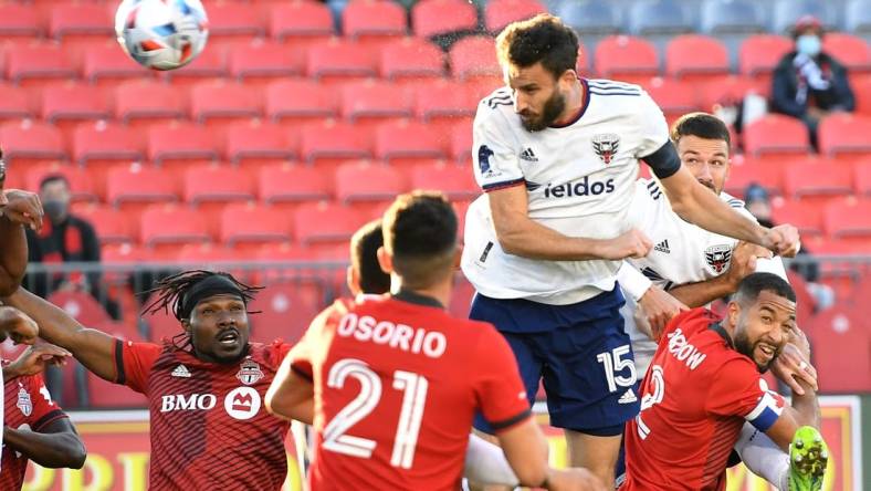 Nov 7, 2021; Toronto, Ontario, CAN;   DC United defender Steven Birnbaum (15) scores on a header against Toronto FC in the first half at BMO Field. Mandatory Credit: Dan Hamilton-USA TODAY Sports