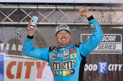 Apr 17, 2022; Bristol, Tennessee, USA; NASCAR Cup Series driver Kyle Busch (18) reacts after winning the Bristol Motor Speedway Dirt Course. Mandatory Credit: Randy Sartin-USA TODAY Sports