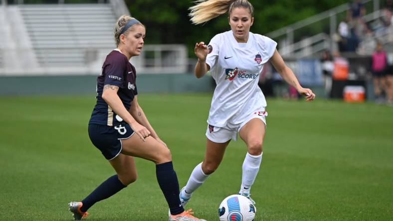 May 7, 2022; Cary, NC, USA;  Washington Spirit midfielder Jordan Baggett (11) moves the ball against North Carolina Courage midfielder Denise O'Sullivan (8) at WakeMed Soccer Park. Mandatory Credit: William Howard-USA TODAY Sports