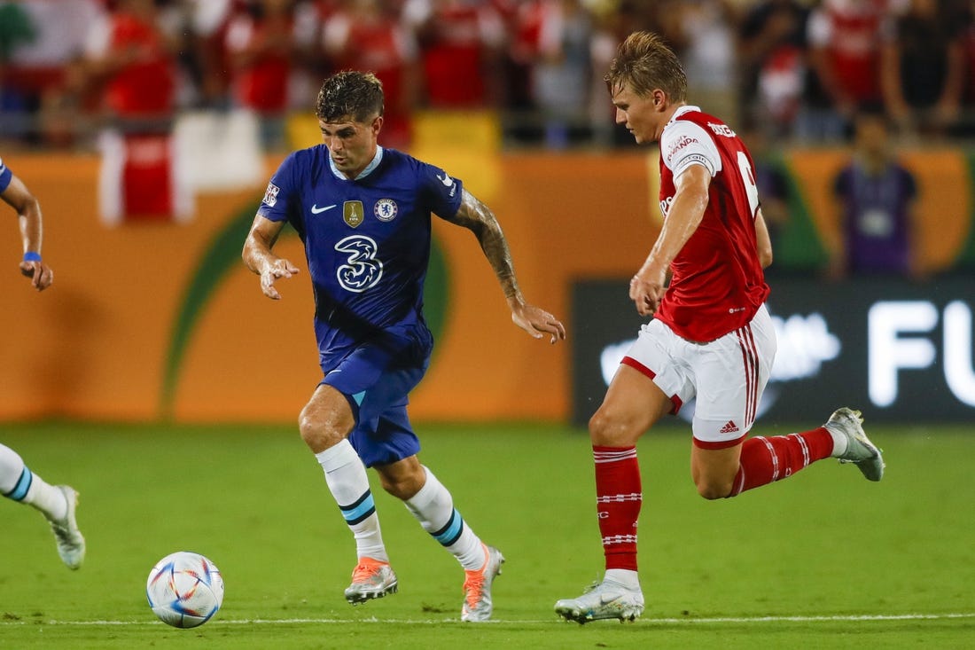 Jul 23, 2022; Orlando, FL, USA; Chelsea forward Christian Pulisic (10) runs with the ball ahead of Arsenal midfielder Martin Odegaard (8) during the second half at Camping World Stadium. Mandatory Credit: Sam Navarro-USA TODAY Sports