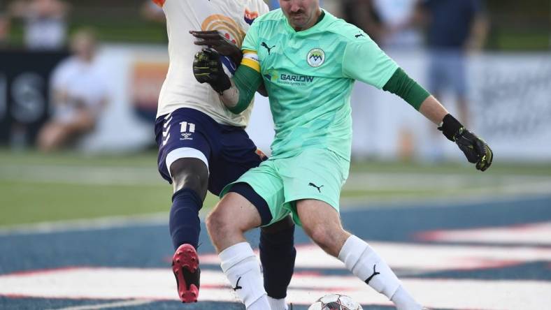 One Knoxville SC's Stephen Afrifa (11) tries to block a kick from West Virginia United goalkeeper Max Collingwood (1) during the regional final soccer match of the USL League Two playoffs at West High School in Knoxville, Tenn. on Sunday, July 24, 2022.

Kns One Knox Regional Championship