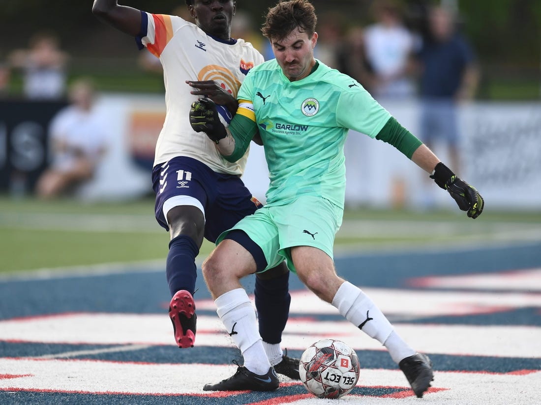 One Knoxville SC's Stephen Afrifa (11) tries to block a kick from West Virginia United goalkeeper Max Collingwood (1) during the regional final soccer match of the USL League Two playoffs at West High School in Knoxville, Tenn. on Sunday, July 24, 2022.

Kns One Knox Regional Championship