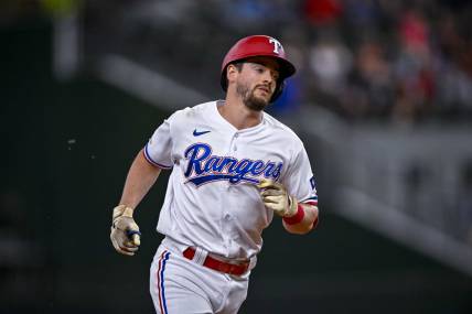 Aug 1, 2022; Arlington, Texas, USA; Texas Rangers pinch hitter Nick Solak (15) rounds the bases after he hits a home run against the Baltimore Orioles during the eighth inning at Globe Life Field. Mandatory Credit: Jerome Miron-USA TODAY Sports